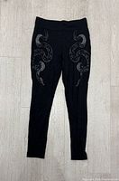 Front view Killstar snake print leggings