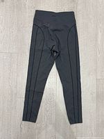Front view of Oysho leggings with vertical seam accents