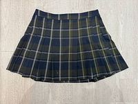 Front view of large plaid pleated skirt