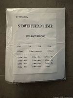 Front of packaged T TANKER shower curtain/liner