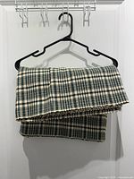 Table runner folded on hanger showing pattern and color