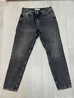 Front view of washed-black Topshop Mom jeans