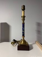 Full view of lamp stand showing brass fittings and wood base