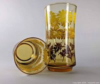 Two amber Libbey Daisy glasses upright and side view