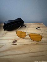 Front oblique view of sunglasses with closed case