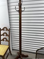 Full view of wood coat rack showing hooks and height