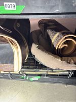 Soft-sided carrier bag and part of crate visible