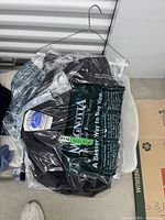 Black jacket size 8-10 in clear garment bag on hanger