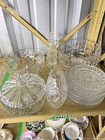 Overall lot on shelf showing all nine crystal pieces