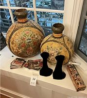 Two hand-painted folk art vases, stacks of Gauguin trays, decorative box