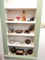 Overall view of built-in shelves showing entire assortment of decorative items