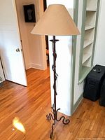 Full view of wrought iron floor lamp with shade