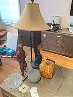 Overall view showing lamp, figurine, decorative box, glass bowl