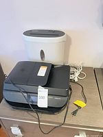 HP OfficeJet 5258 printer in front, GoECOlife shredder behind, cords visible