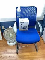Chair, heater, boxed phone together