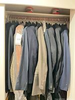 Full closet view showing multiple jackets on rod