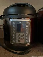 Front view of Mealthy MultiPot showing control panel and power cord