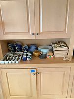 Cabinet shelf with entire mixed lot visible