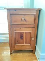 front view closed showing drawer and cabinet door