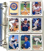 binder open showing nine cards per sheet