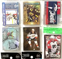 Fronts of assorted Tim Hortons insert cards and sealed Post Pinnacle box