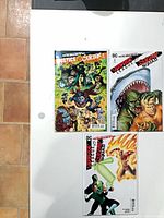 Three comics laid out: standard #5, variant #5, blank/white variant #6