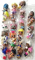 Front view of bagged LOL Surprise dolls arrayed vertically