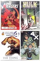 All four comic covers side by side showing titles and condition
