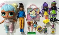 Group shot of all dolls, accessories, erasers and figure