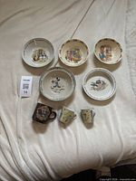 Group shot showing 5 bowls and 3 mugs