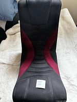 Full view of black and red mesh floor gaming chair