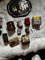 Overview of all tins and tray on white background