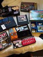 All four game boxes opened showing components