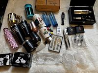 Overview of entire lot showing drinkware, barware, boxed items and accessories