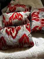 Four patterned side pillows on bed