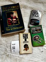Front view of all four Star Trek paperbacks