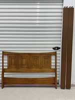 Headboard front view with side rails leaning