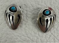 Front view showing bear claw design and turquoise stones