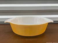 Side view showing orange exterior and white interior