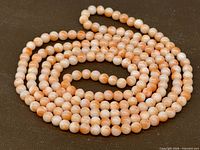 Coiled view of full strand showing bead color and pattern