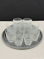 Top view of tray holding nine crystal scotch glasses