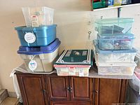 Overall view of stacked storage totes on cabinet