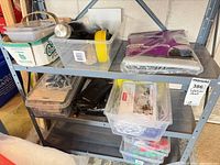shelving with bins showing various lot items together