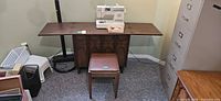 Full view of cabinet, stool and sewing machine setup