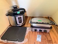 T-fal EPC06 pressure cooker, Cuisinart Griddler, removable grill plate on wooden surface
