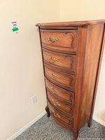 Front view of tall six-drawer chest showing overall style and hardware