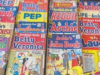 Overhead view of part of collection showing multiple Archie titles in vertical rows
