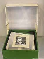 Album in open presentation box