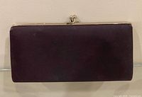 Front view of black satin clutch showing overall design