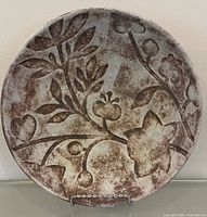 Front view of the Michael Kline ceramic plate showing full floral design